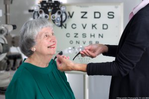 an older woman receiving a low vision exam