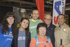 Andrea Croak with a number of individuals at the Expo for the California International Marathon, including Aaron Scheidies