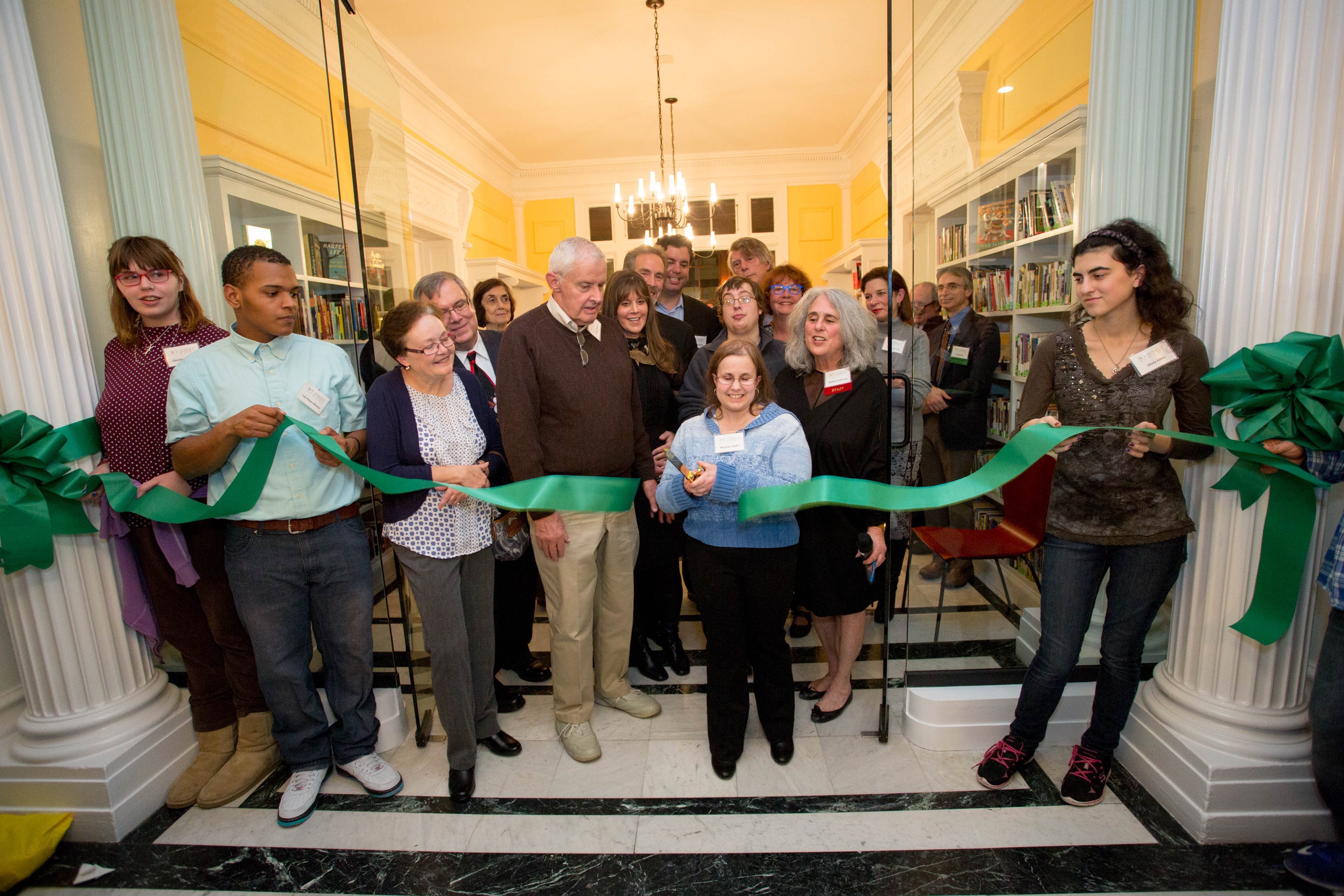 Donors, students, families, staff, and supporters gather to cut the ribbon on Ivy Street School's Solarium and Library